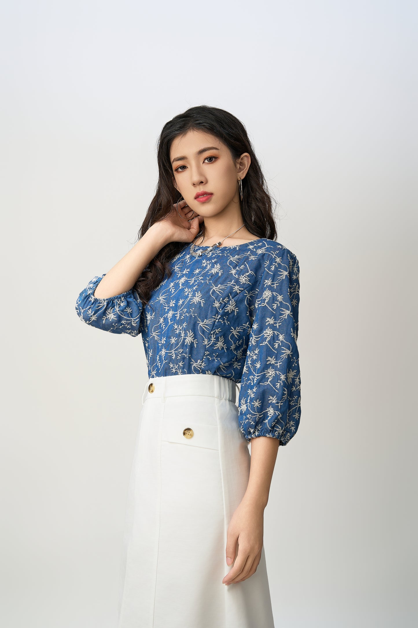 Blue Blouse Adorned With White Floral